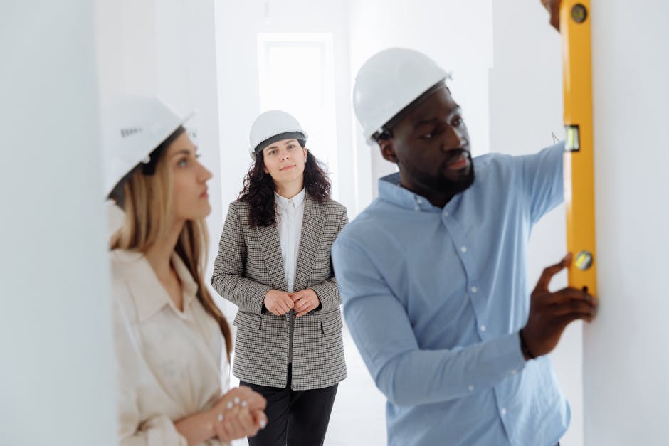 Friendly construction contractor reviewing plans